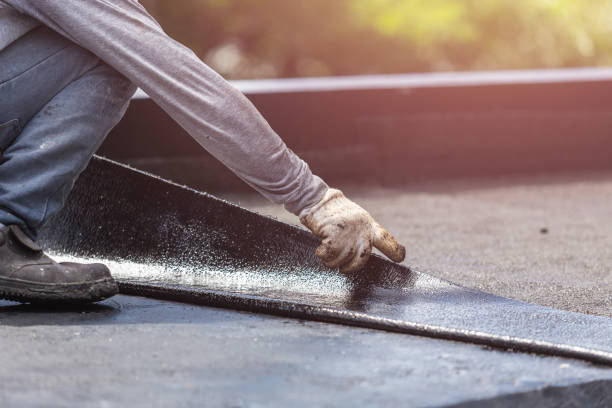 Professional Basement Waterproofing technician working in Interlaken, NY